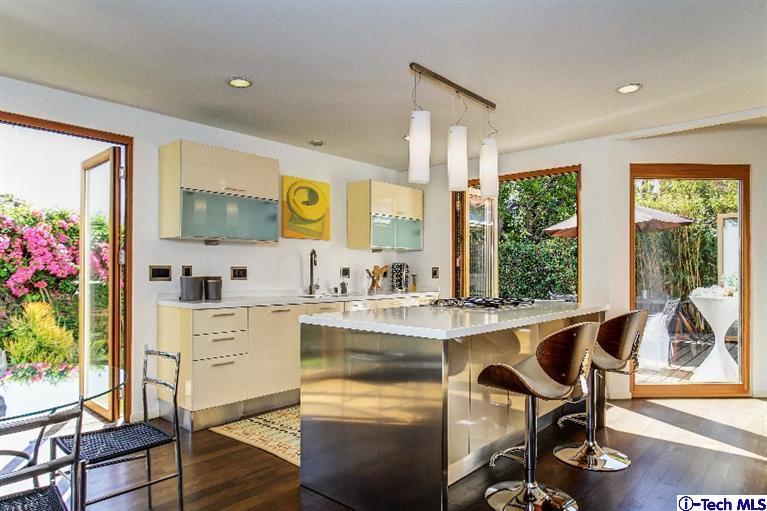 386 South Meridith Avenue Pasadena, CA 91106 - Photo 8 of 28 a view of a kitchen area with furniture and wooden floor