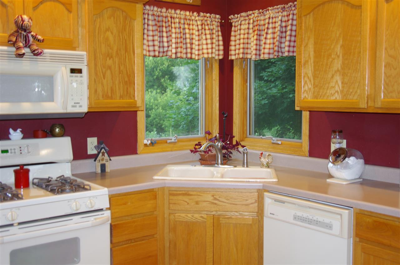 8407 North Kilbuck Road Monroe Center, IL 61052 - Photo 11 of 20 a kitchen with a sink and a window