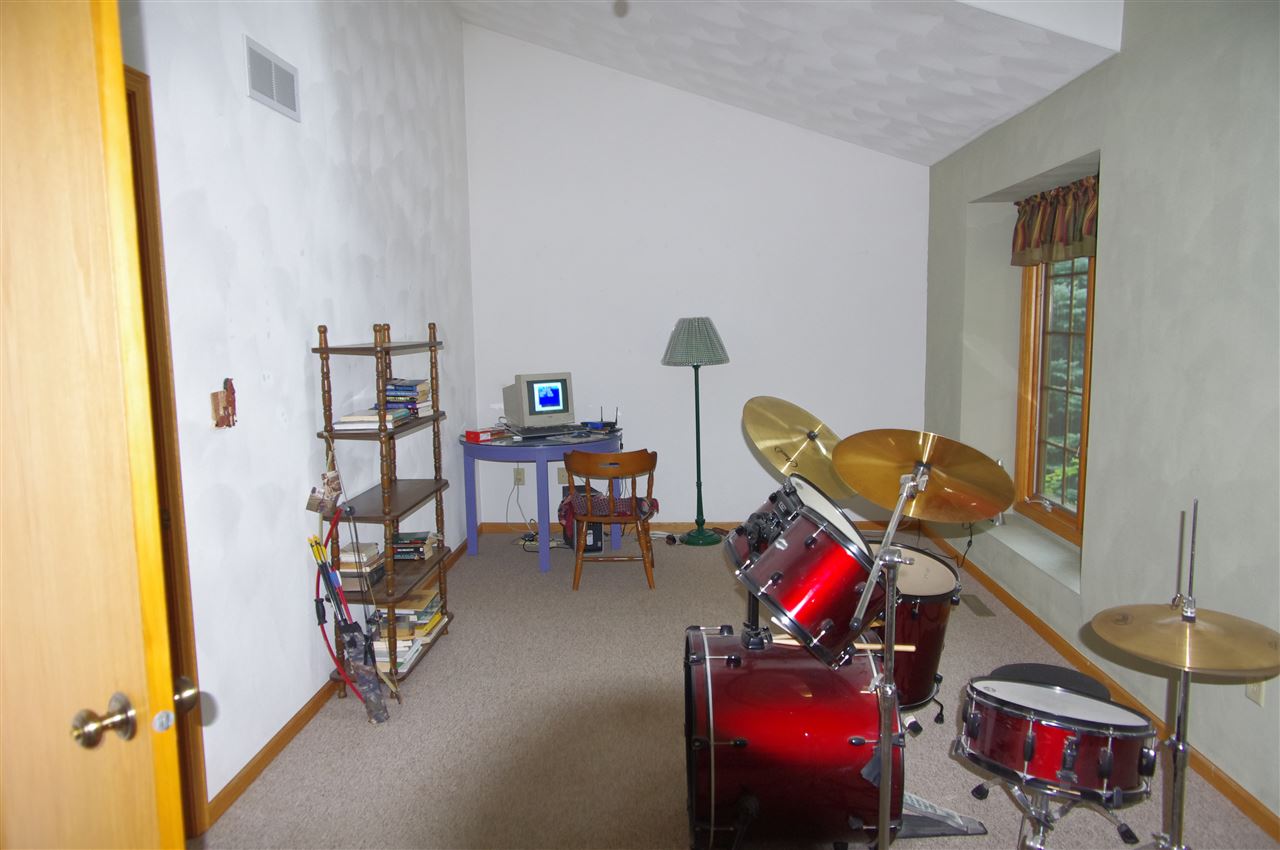 8407 North Kilbuck Road Monroe Center, IL 61052 - Photo 15 of 20 a living room with furniture and a wooden floor