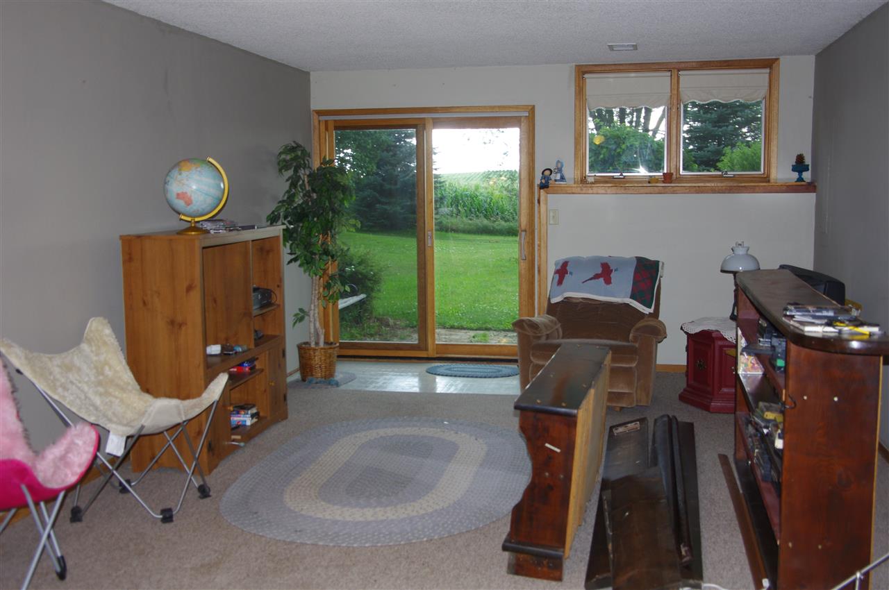 8407 North Kilbuck Road Monroe Center, IL 61052 - Photo 17 of 20 a living room with furniture and a window