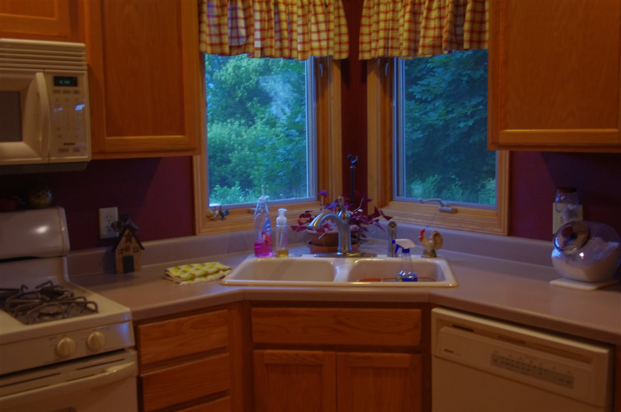 8407 North Kilbuck Road Monroe Center, IL 61052 - Photo 10 of 20 a kitchen with a sink and cabinets
