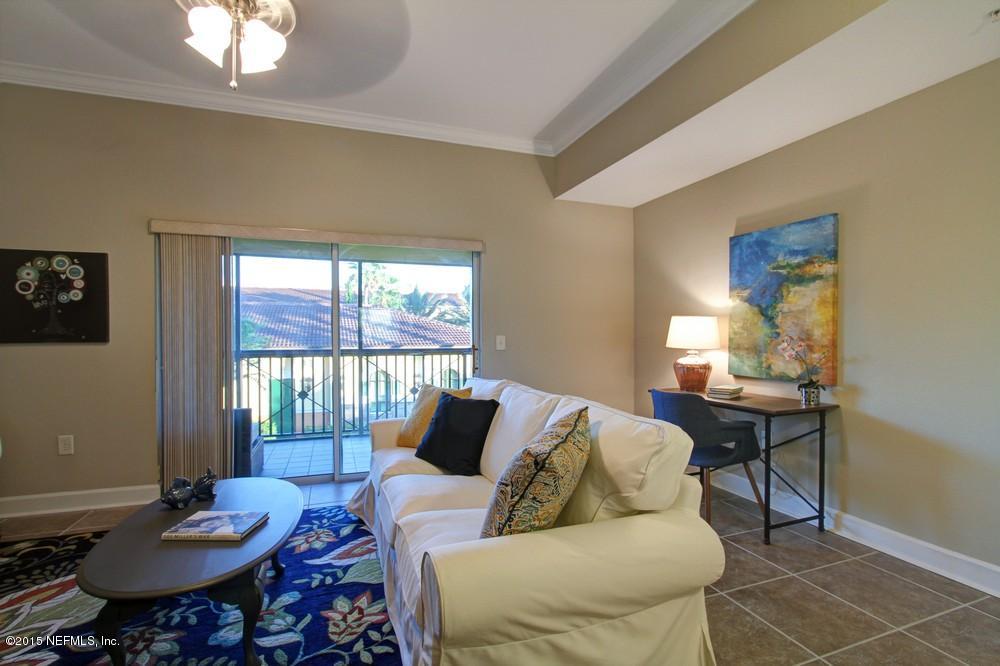 9745 Touchton Road, Unit 2029 Jacksonville, FL 32246 - Photo 8 of 37 a living room with furniture and a table