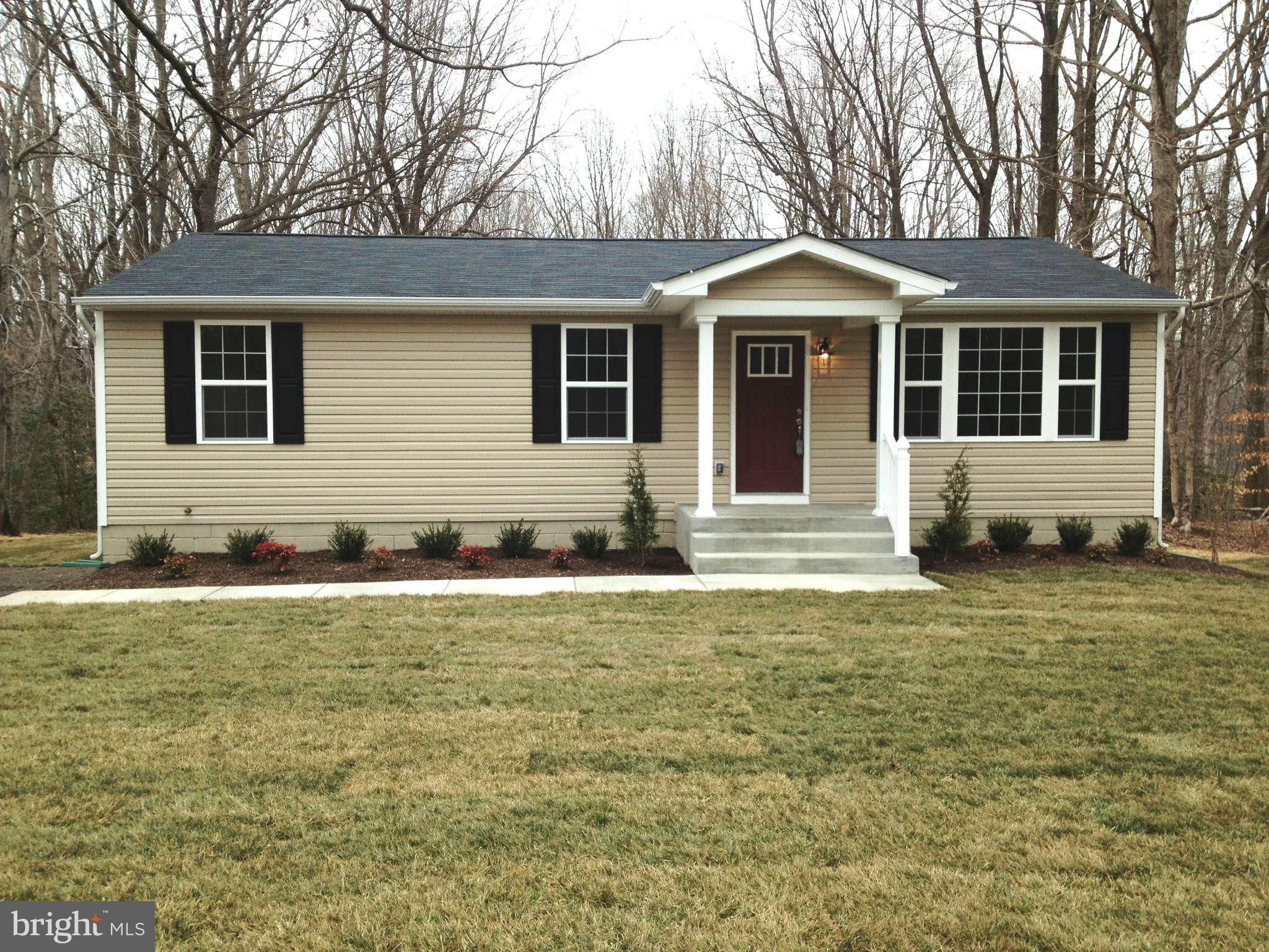 361 Emerson Road Owings, MD 20736 - Photo 1 of 25 a front view of a house with a yard