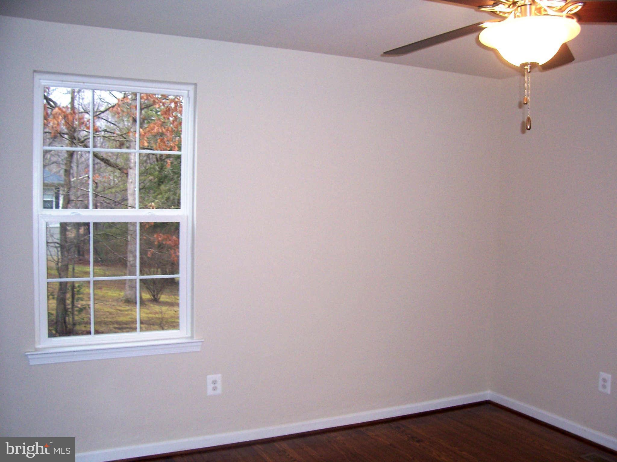 361 Emerson Road Owings, MD 20736 - Photo 11 of 25 an empty room with a window