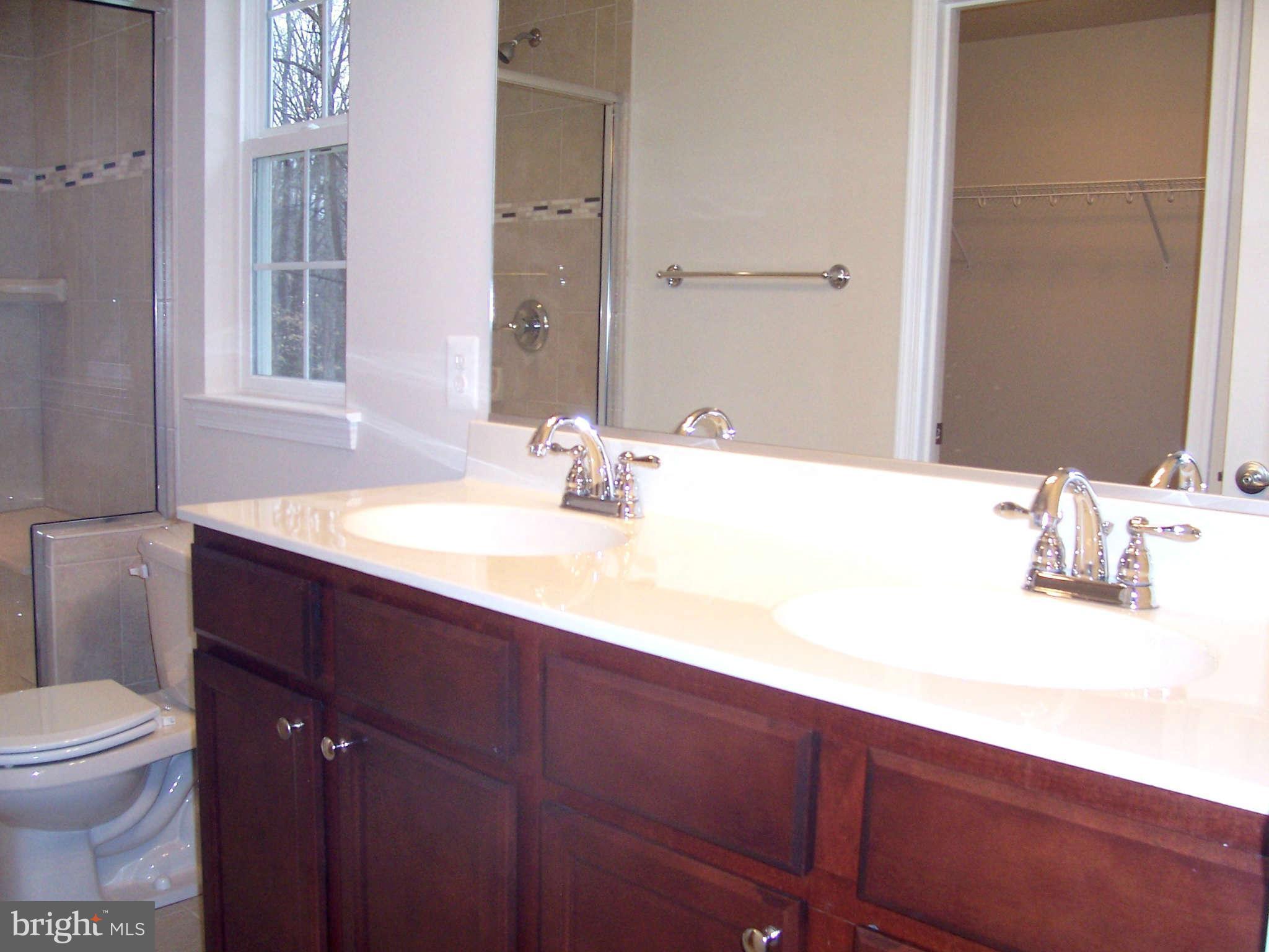 361 Emerson Road Owings, MD 20736 - Photo 12 of 25 a bathroom with a sink and a toilet