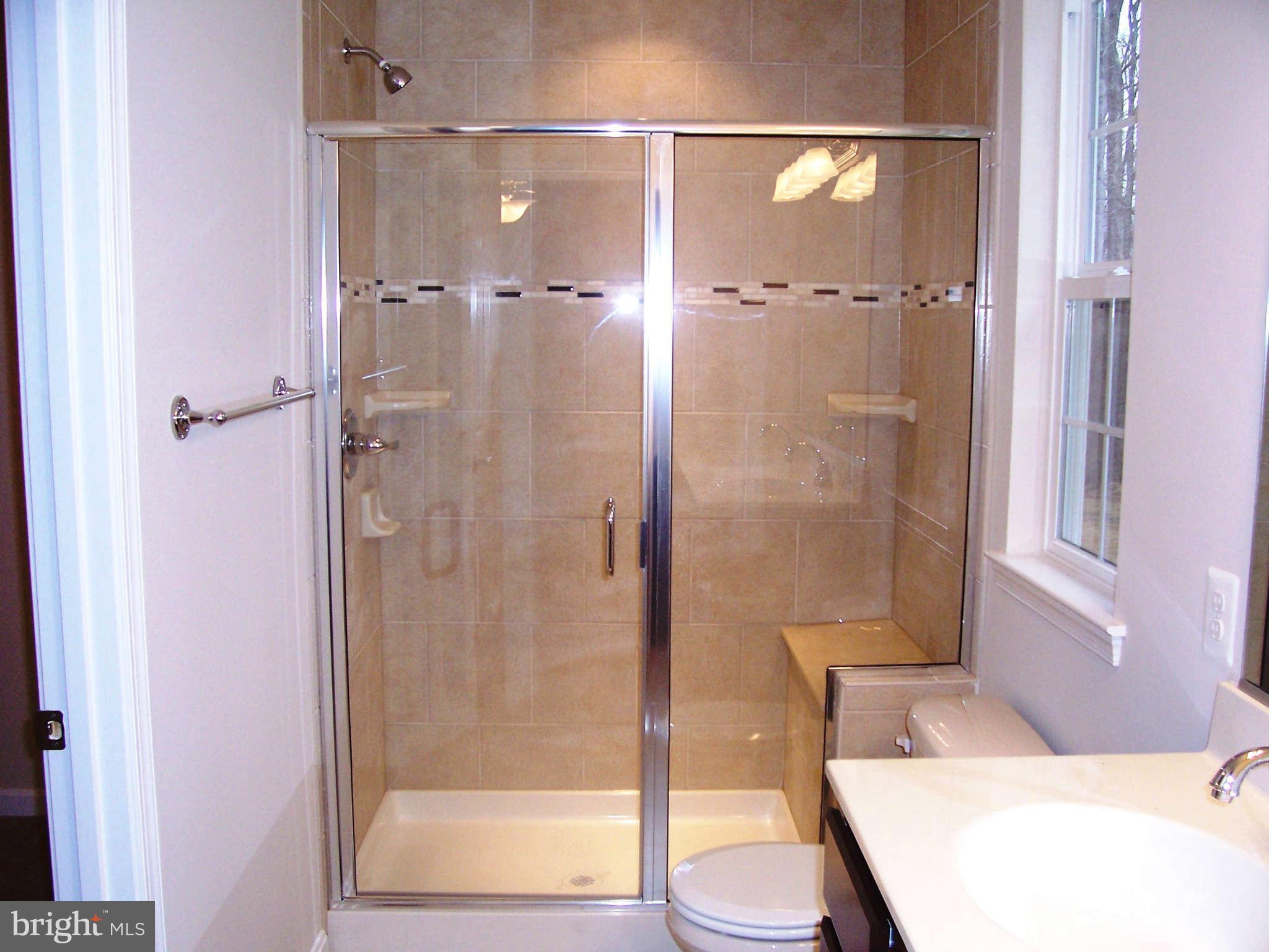 361 Emerson Road Owings, MD 20736 - Photo 13 of 25 a bathroom with a shower and a toilet