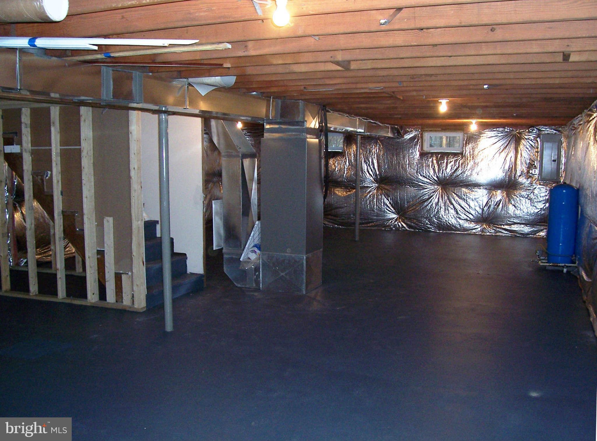 361 Emerson Road Owings, MD 20736 - Photo 20 of 25 a view of water heater room with stairs