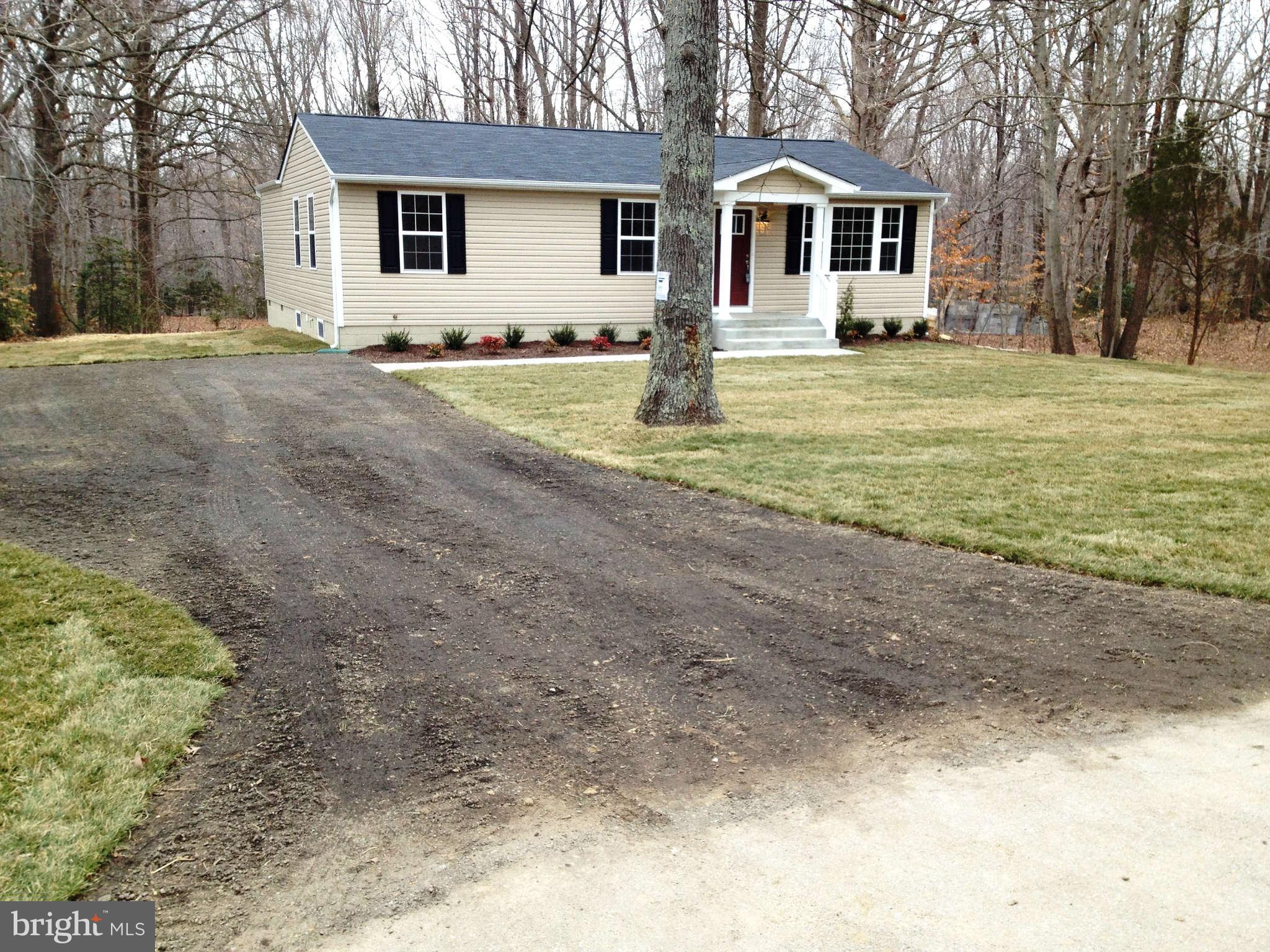 361 Emerson Road Owings, MD 20736 - Photo 23 of 25 a front view of a house with a yard