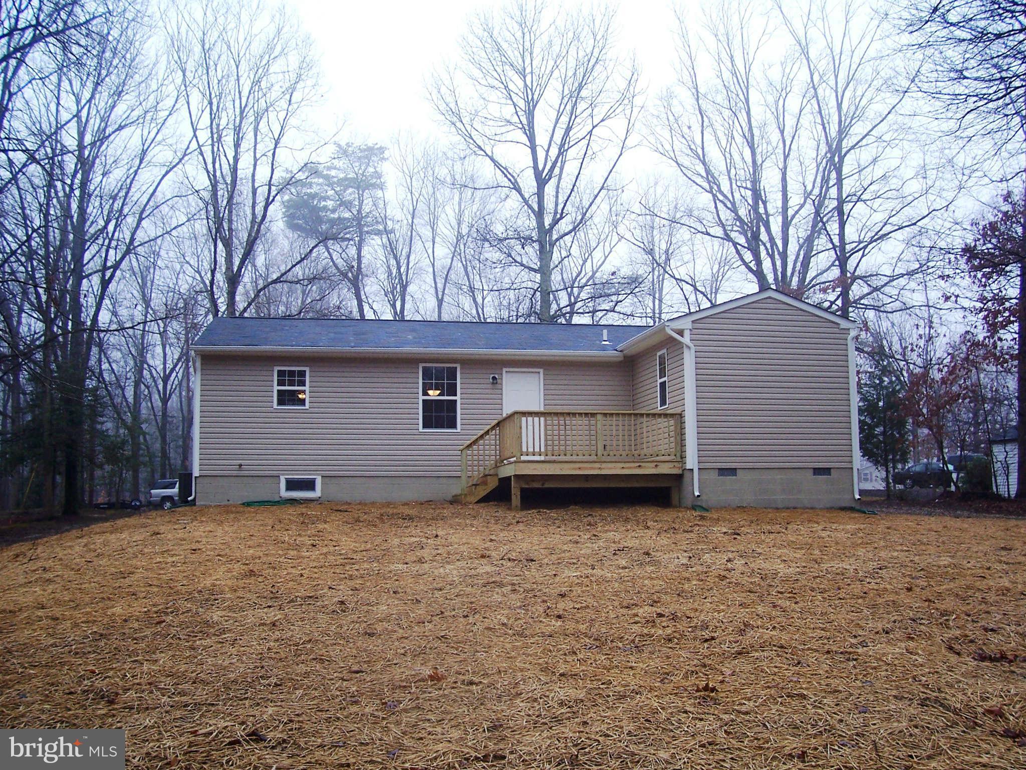 361 Emerson Road Owings, MD 20736 - Photo 24 of 25 a house that has a tree in front of it