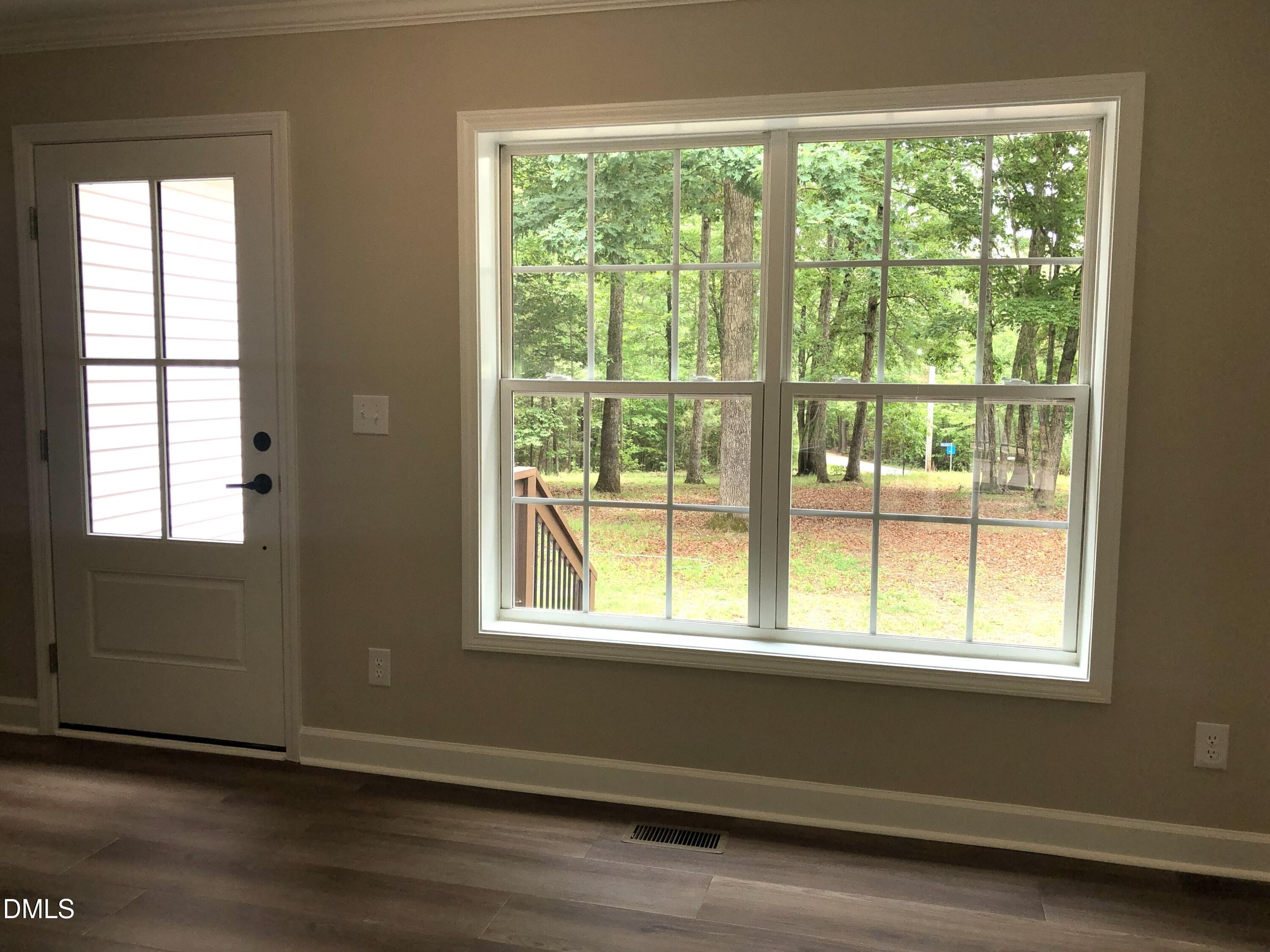 95 Smith Taylor Trail Roxboro, NC 27574 - Photo 24 of 47 a view of empty room with wooden floor and fan