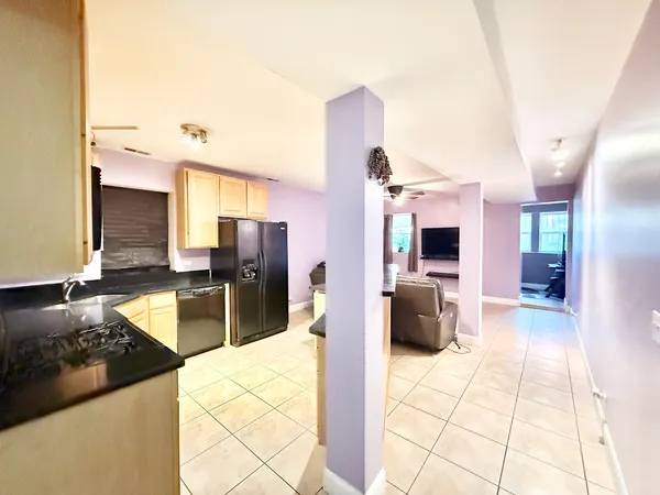 a kitchen with a sink stove and refrigerator