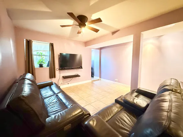 a view of a room with furniture and a window