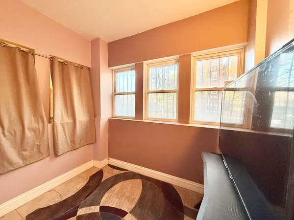 a bedroom with a bed and a rug