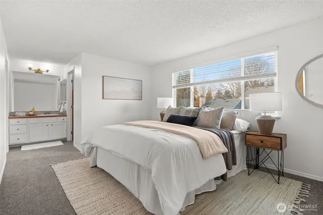 a bed room with a bed and a table