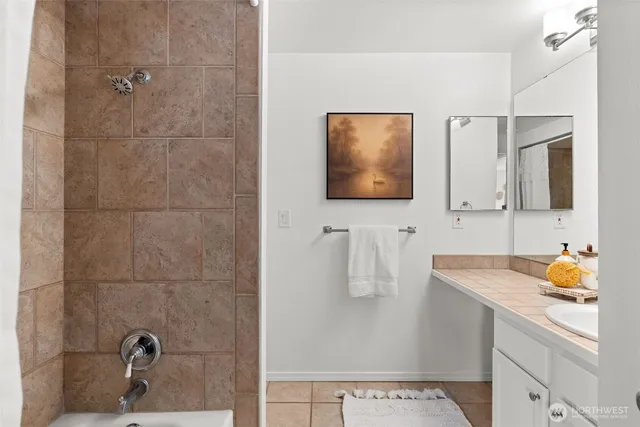 a balcony with a table and chairs