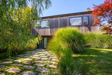 a front view of a house with a yard