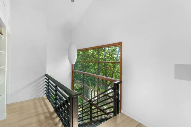 a view of stairs and wooden floor