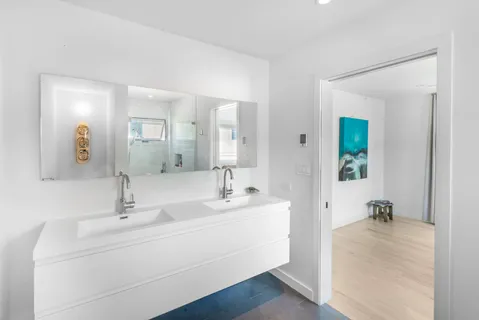 a bathroom with a sink and a mirror