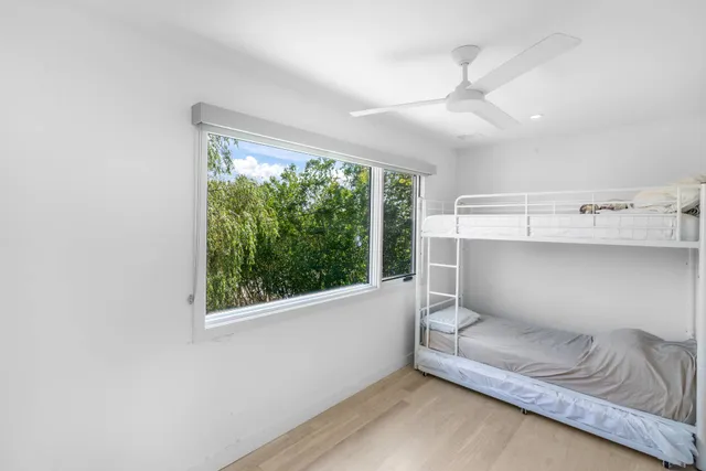 a living room with a couch and a large window