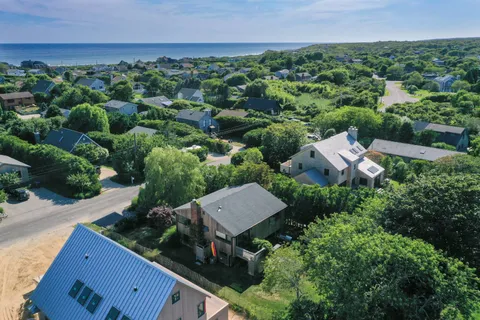an aerial view of a house with a garden