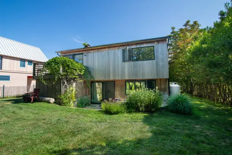 a view of a house with a yard and plants