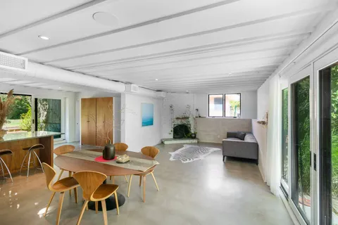 a view of a dining room with furniture window and outside view