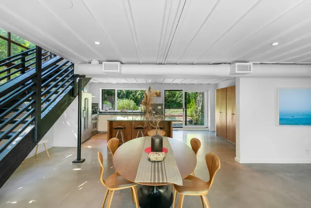 a view of a dining room with furniture window and outside view