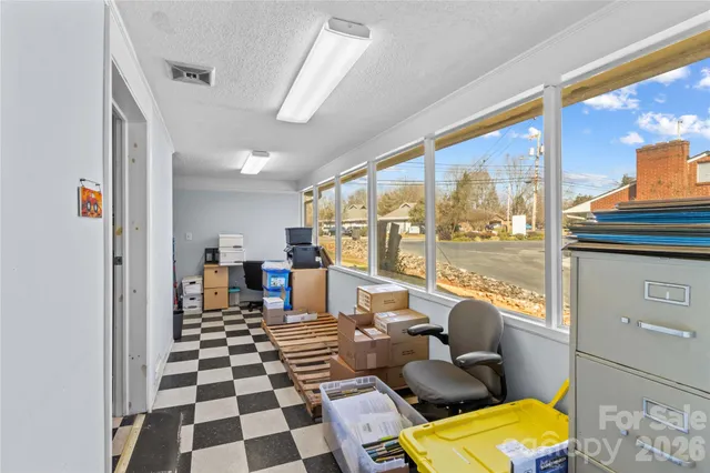 a room with furniture a rug and a window
