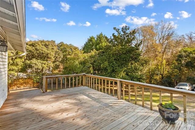 a view of a balcony with wooden floor