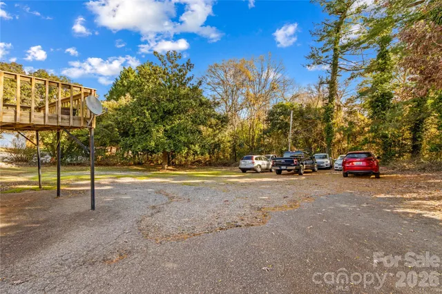 a view of street with parked cars