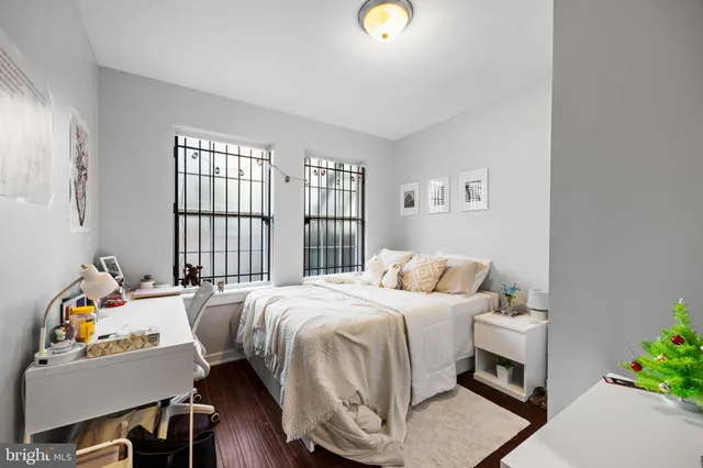 a bedroom with a bed and a couch