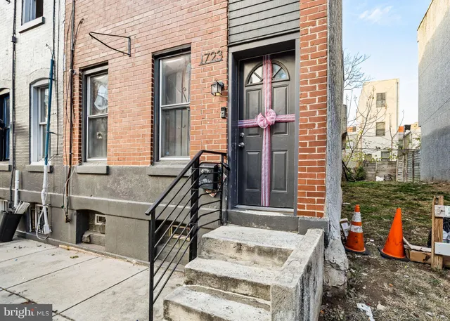 a view of a livingroom with furniture stairs and a living room