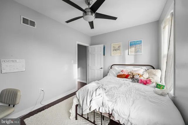 a view of a livingroom with wooden floor and couch