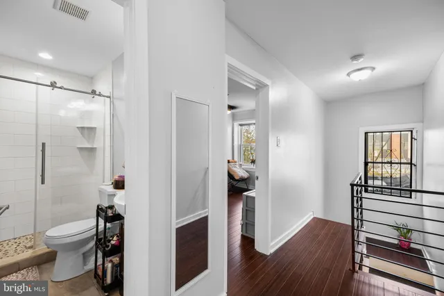 a view of empty room with wooden walls