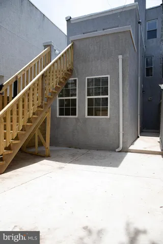 a view of table and chairs in patio