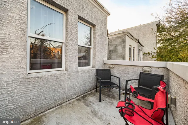 a couple of cars parked in front of a building