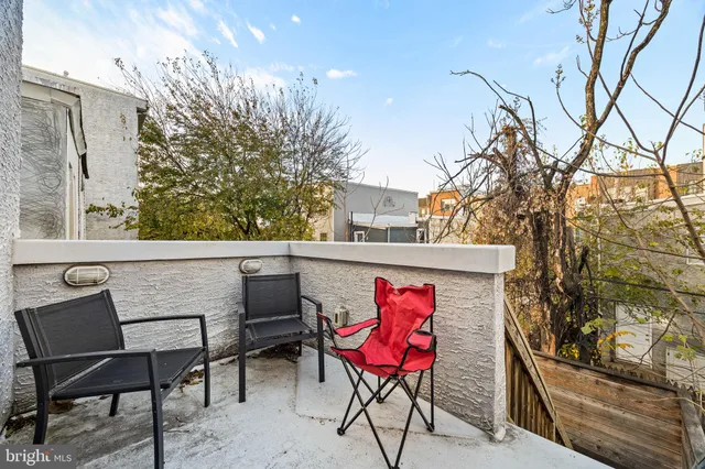 a view of a car parked in front of a building
