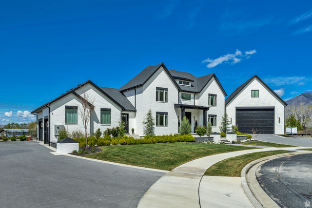 1720 Hillcrest Circle Mapleton, UT 84664 - Photo 112 of 116 Modern farmhouse style home featuring a front lawn, a garage, and brick siding