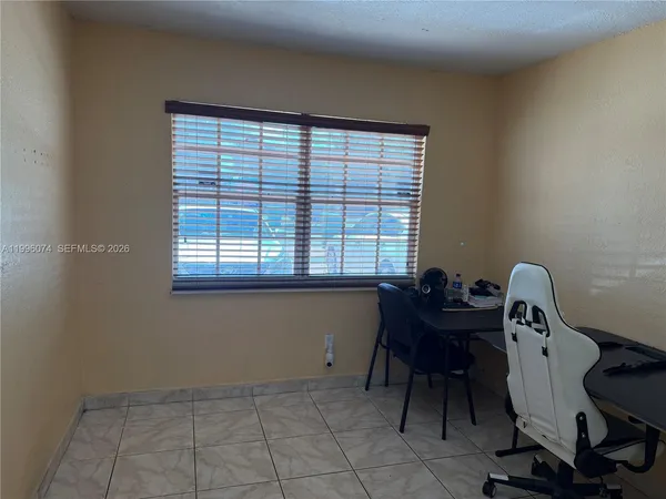 a workspace with furniture and a window