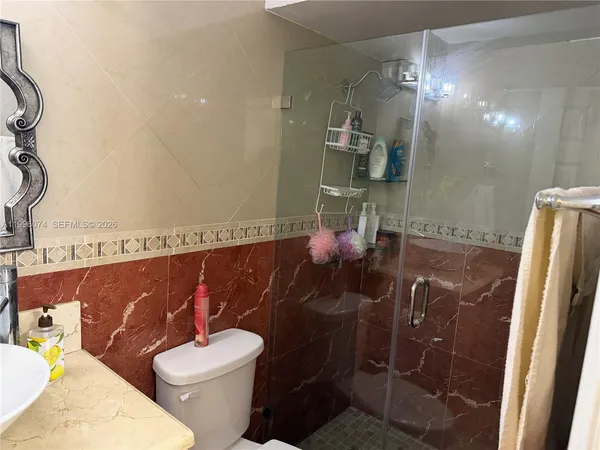 a bathroom with a toilet and a sink