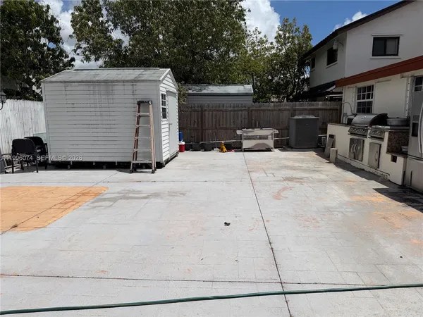 a view of a backyard of the house