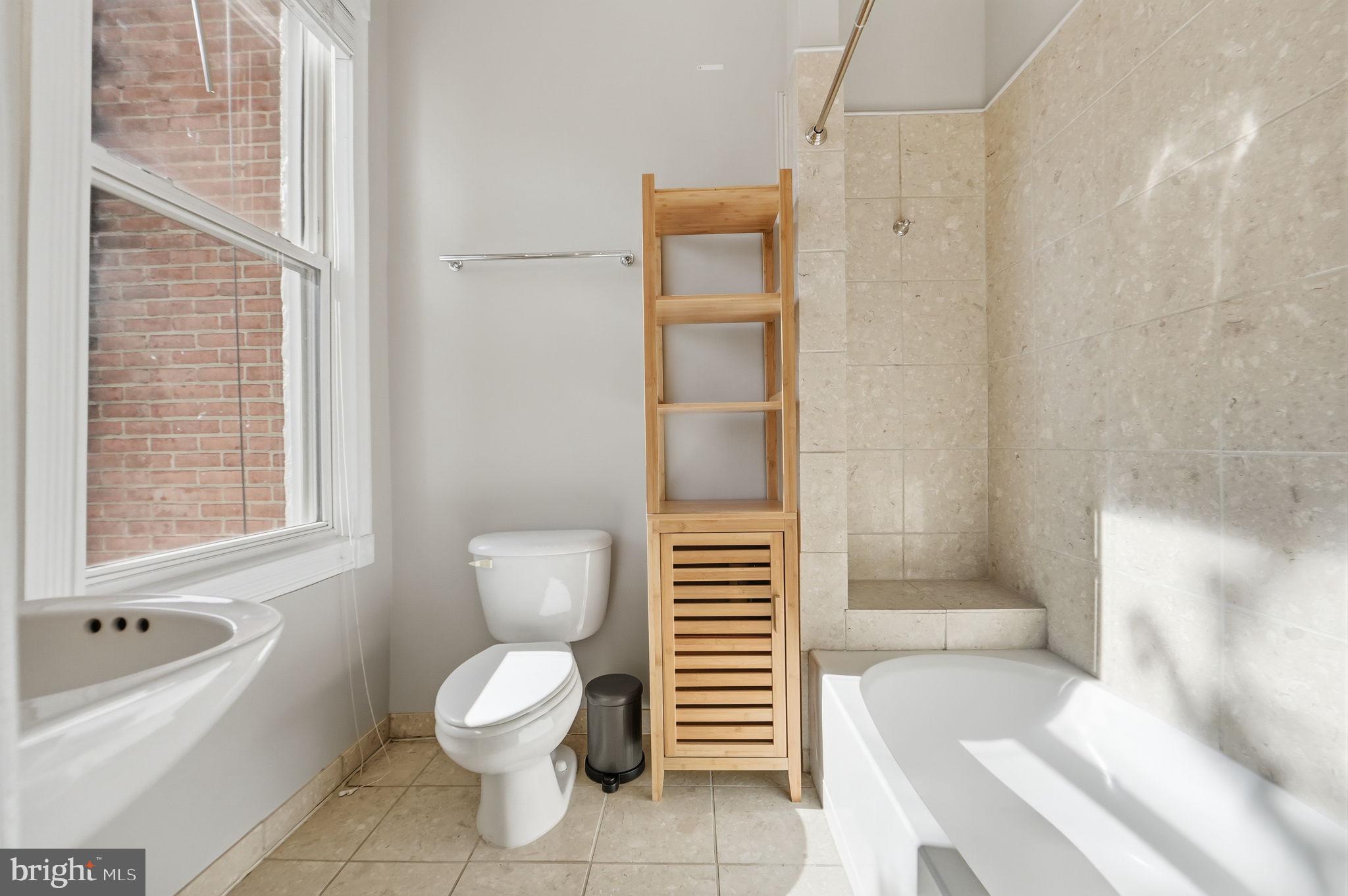 706 12th Street Northeast Washington, DC 20002 - Photo 28 of 49 a bathroom with a toilet and a bathtub