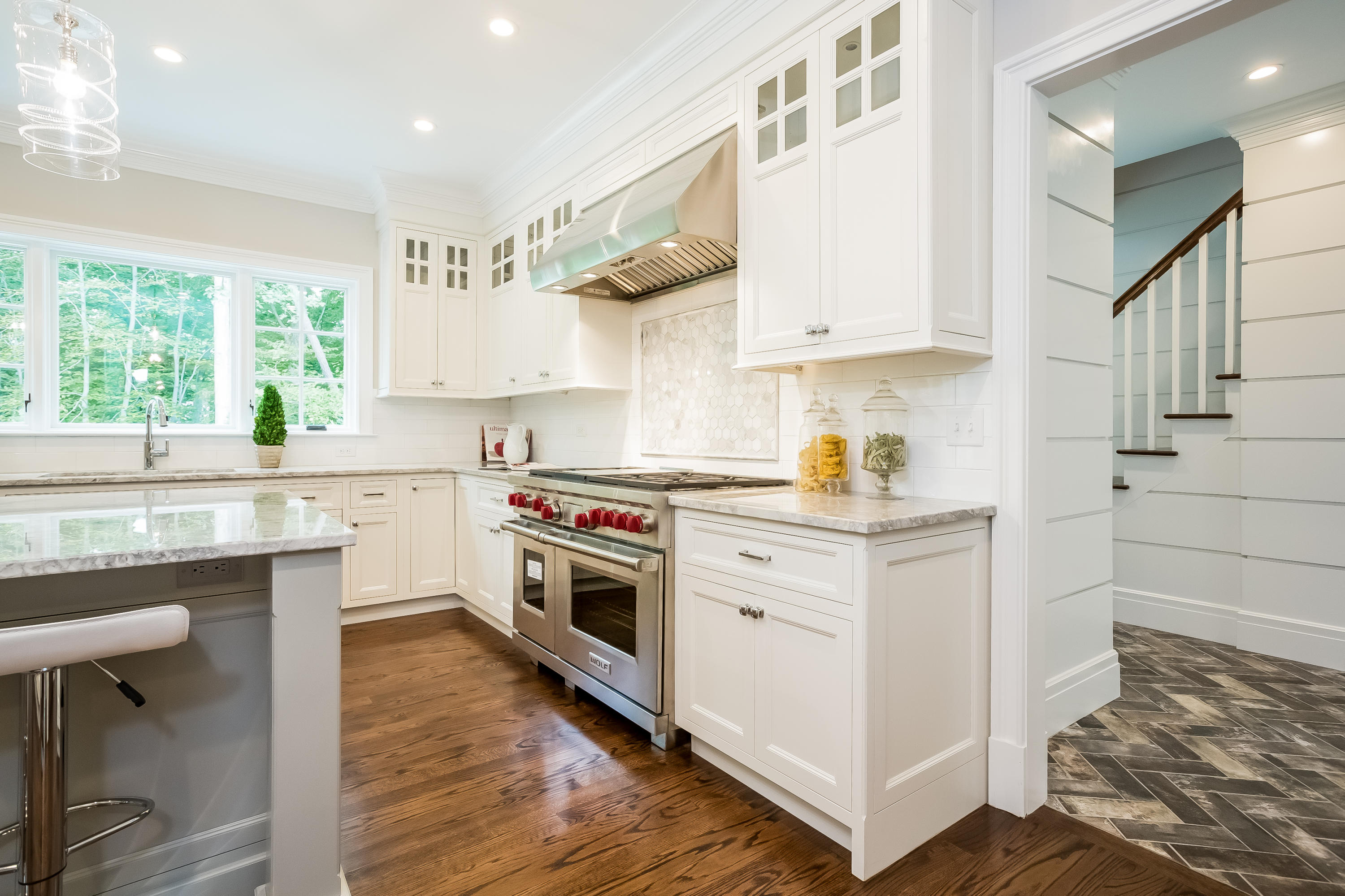 35 Old Parish Road Darien, CT 06820 - Photo 19 of 74 a kitchen with granite countertop a sink cabinets and wooden floor