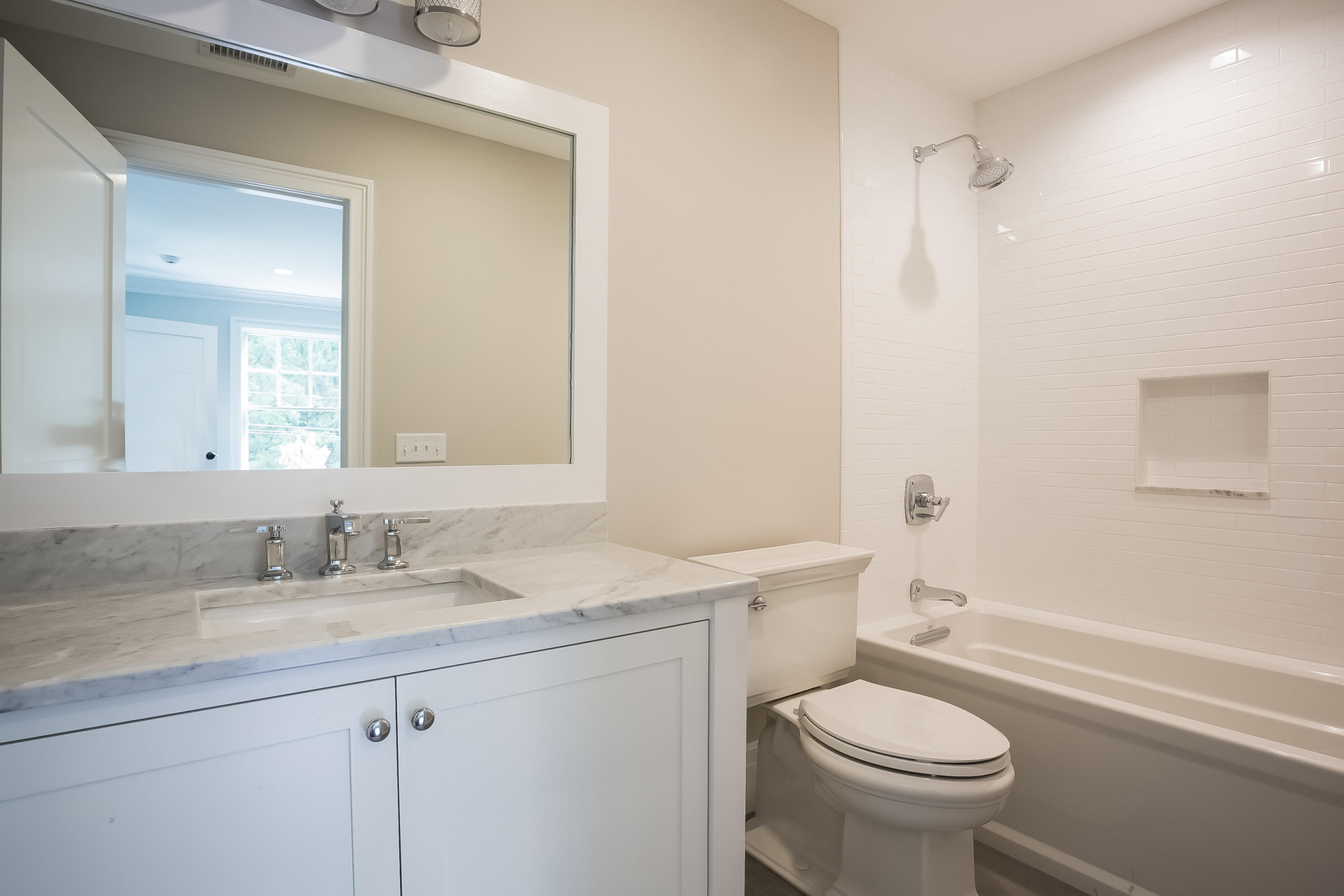 35 Old Parish Road Darien, CT 06820 - Photo 49 of 74 a bathroom with a sink toilet vanity and shower