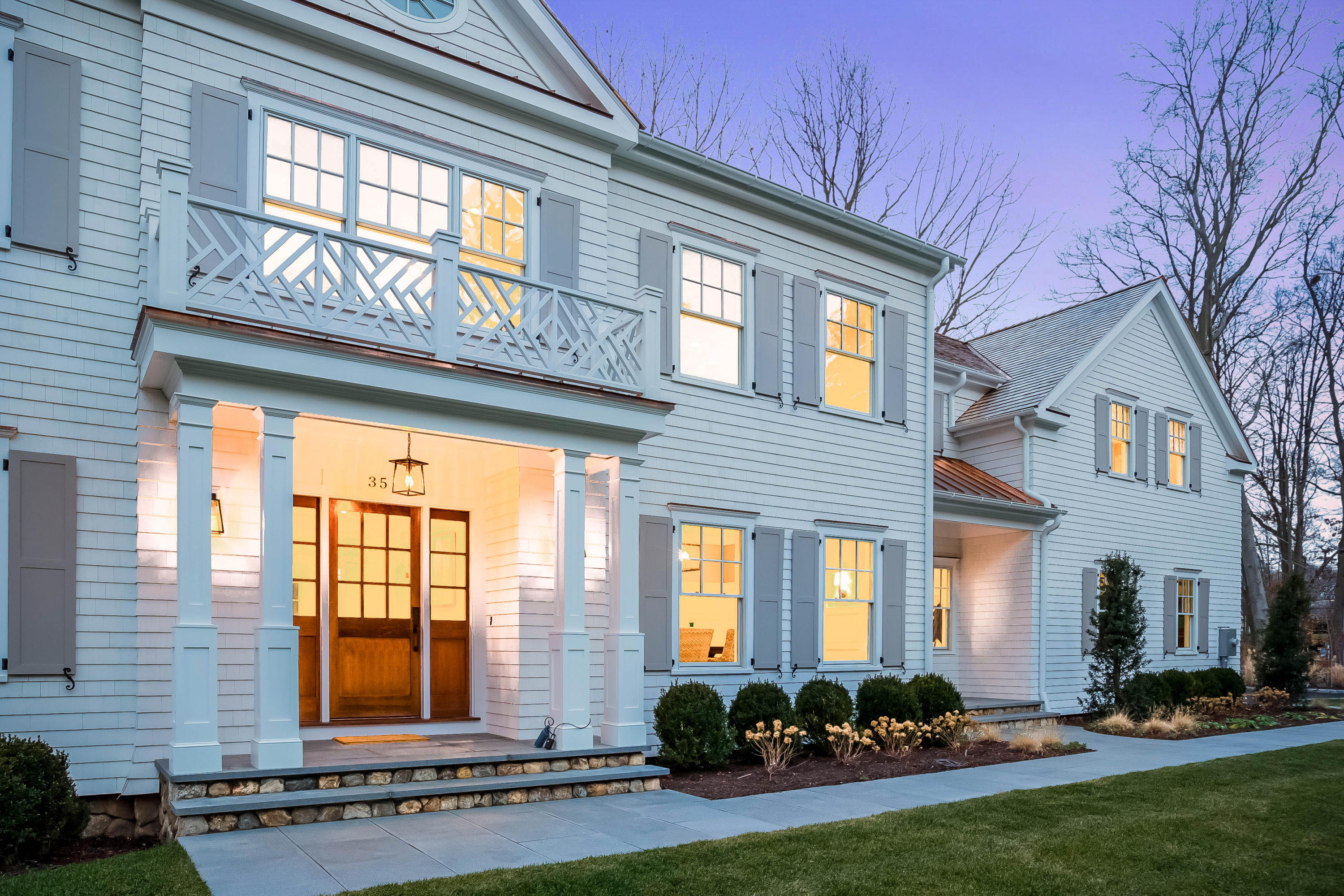 35 Old Parish Road Darien, CT 06820 - Photo 55 of 74 a front view of a brick house with a outdoor seating