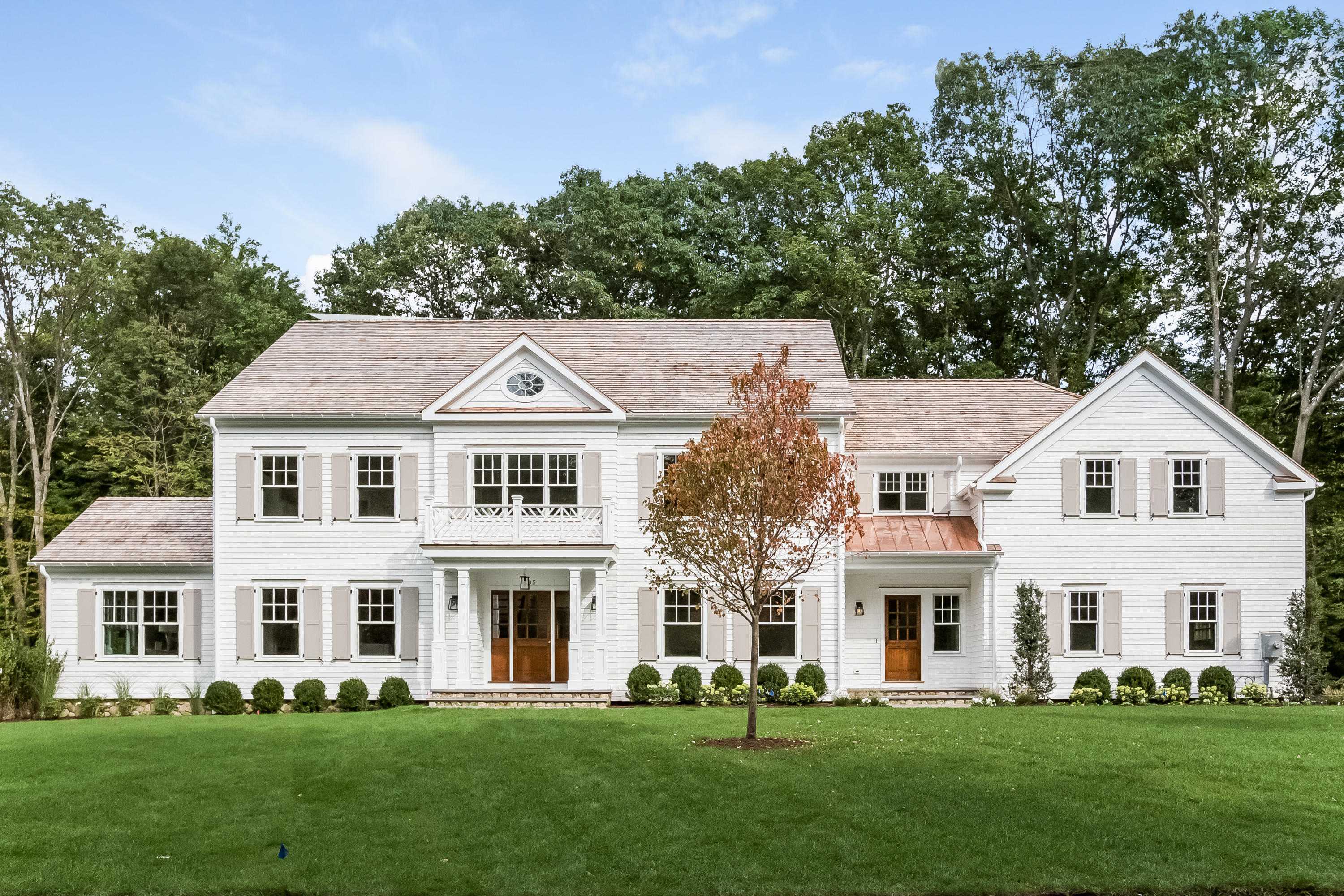 35 Old Parish Road Darien, CT 06820 - Photo 57 of 74 a front view of a house with a garden and trees