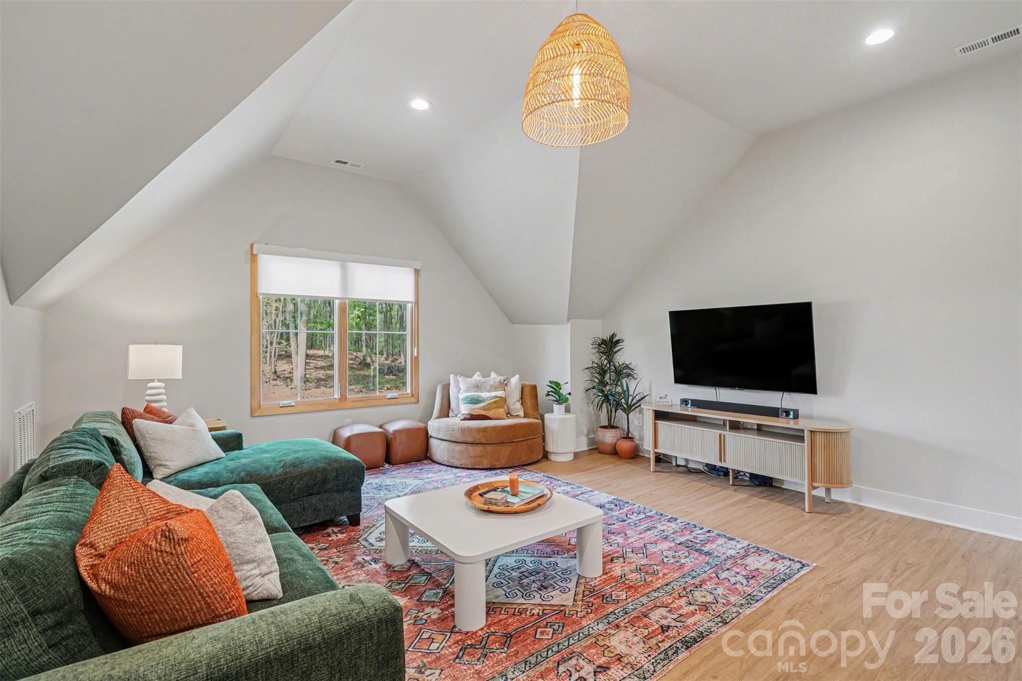 12141 Coyle Road Stanfield, NC 28163 - Photo 13 of 26 a living room with furniture and a flat screen tv