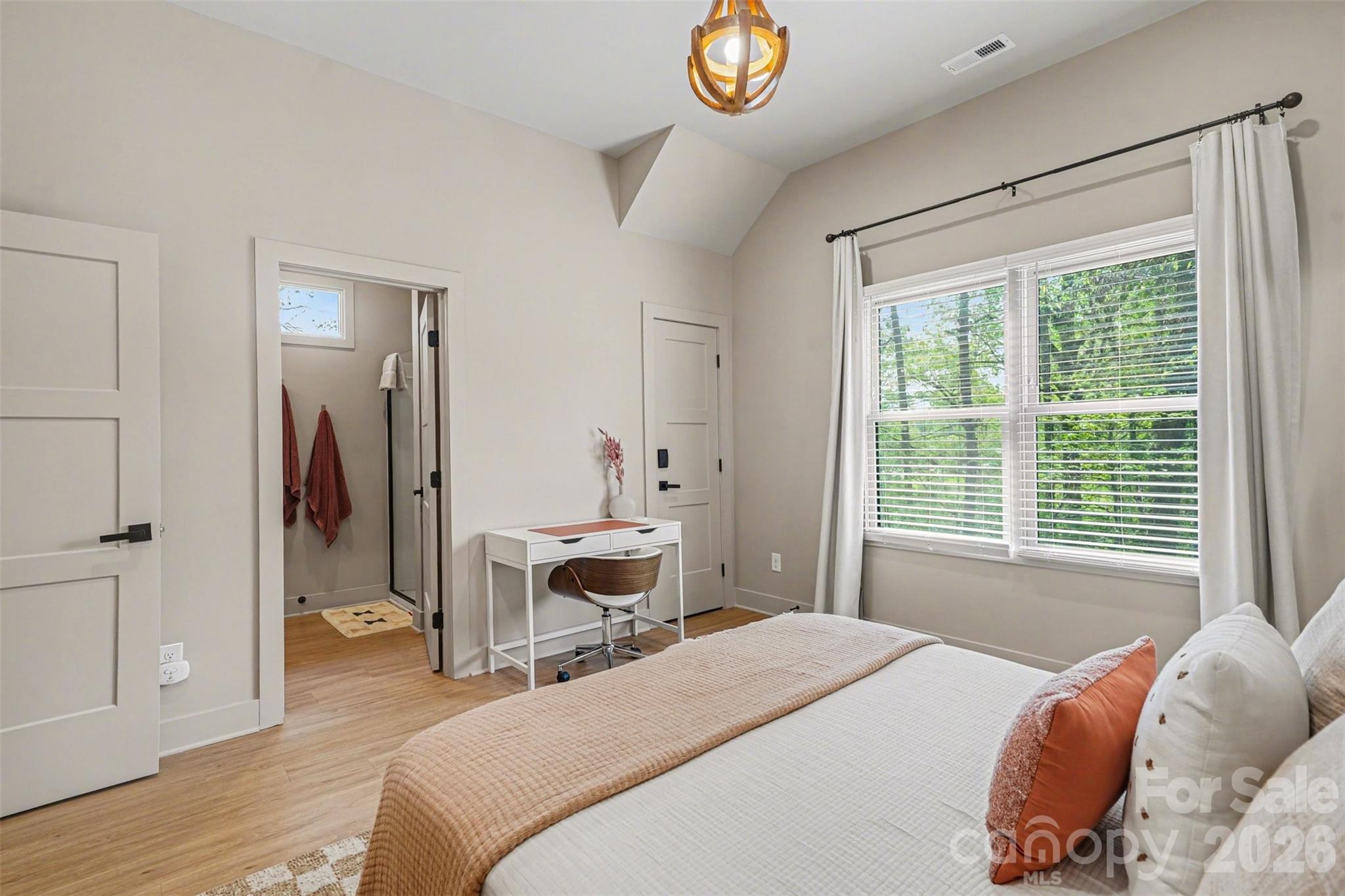 12141 Coyle Road Stanfield, NC 28163 - Photo 16 of 26 a bedroom with a bed and a table