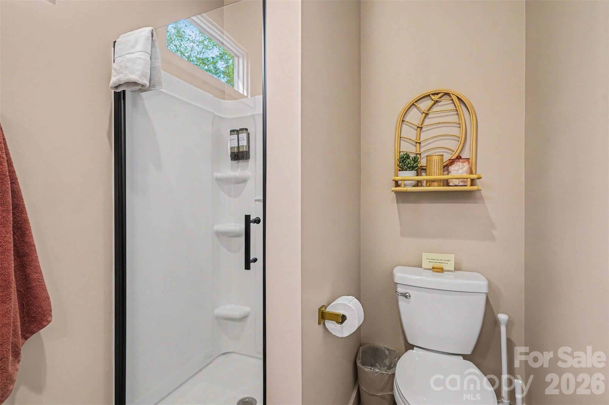 12141 Coyle Road Stanfield, NC 28163 - Photo 20 of 26 a bathroom with a toilet a sink and mirror