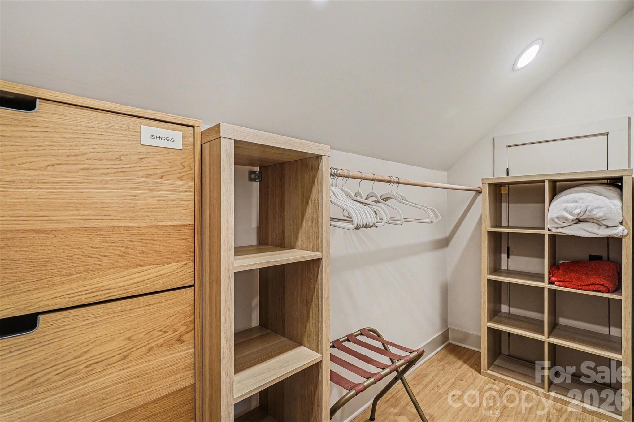 12141 Coyle Road Stanfield, NC 28163 - Photo 21 of 26 a view of walk in closet with empty racks